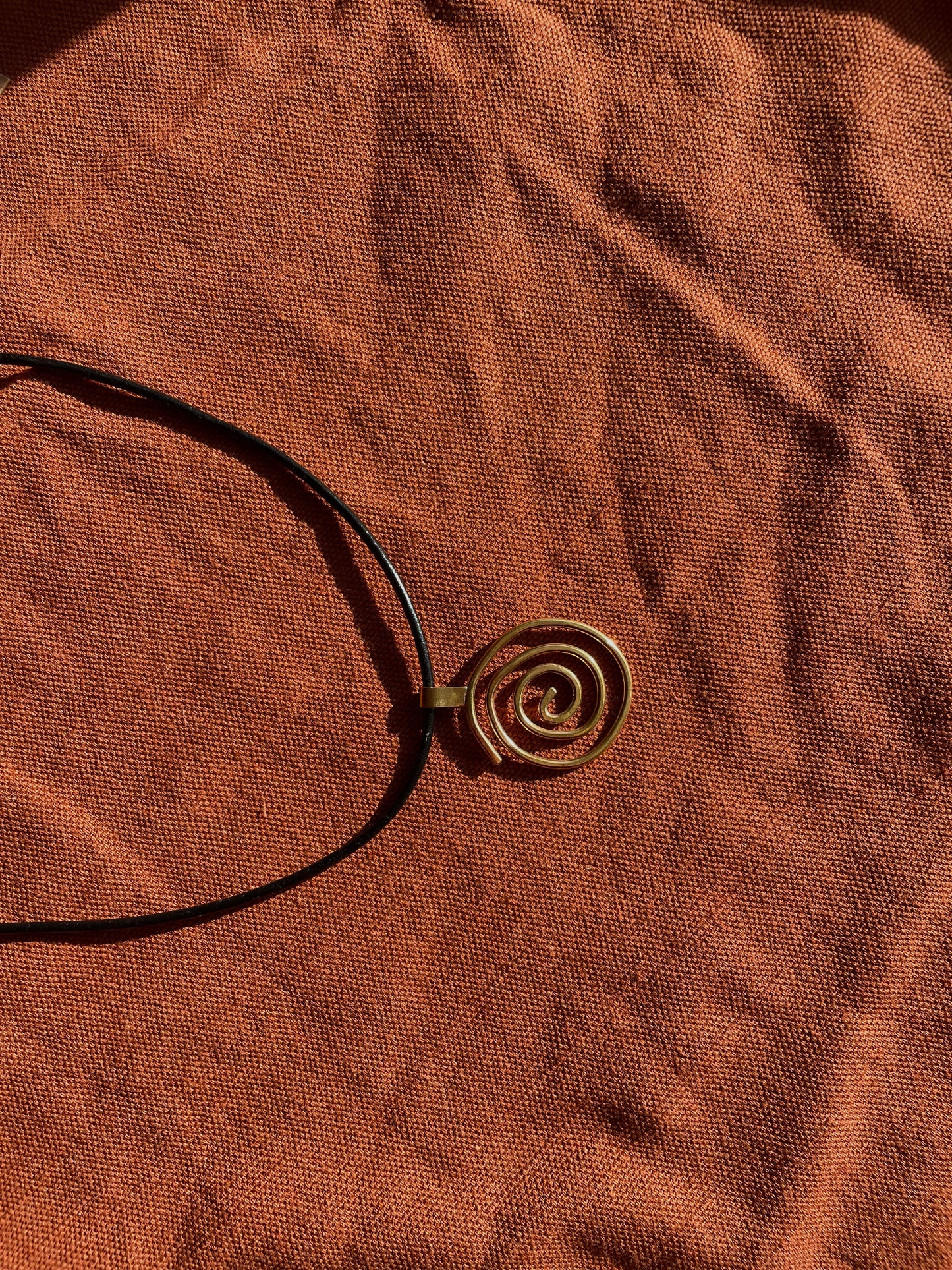 Swirl Girl Brass Pendant
